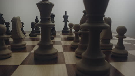 One-Person-Hand-Practices-Strategic-Tactical-Moves-in-Chess-Game,-Low-Close-up