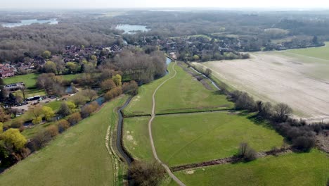Flying-backwards-over-the-green-pastures-and-the-River-Great-Stour-at-Fordwich,-England
