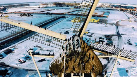Flock-of-Great-Cormorant-Sit-on-Windmill-in-Harderwijk,-Netherlands,-Aerial-Close-Up-View