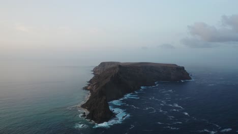 Daybreak-at-rugged-wild-rocky-island-of-Ilhéu-da-Cal-in-Porto-Santo,-Atlantic