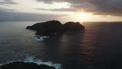 Stunning-sunset-creating-silhouette-of-Ilhéu-de-Ferro,-island-of-Porto-Santo