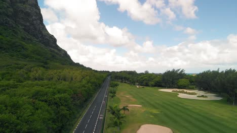 Aerial-view-of-a-road-beside-the-golf-course