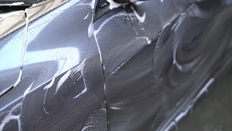 close-up-grey-car-with-washing-foam