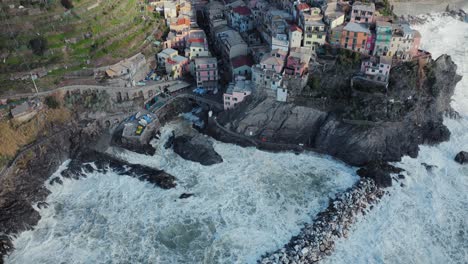 Aerial-view-of-Manarola,-5-Terre,-with-moving-sea