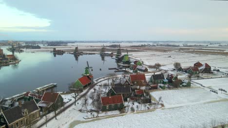 Traditional-Dutch-buildings-and-windmills-in-rural-area-during-winter-season
