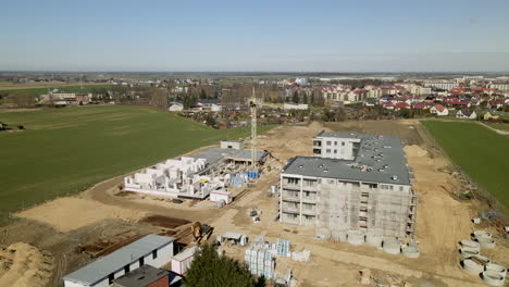 Aerial-shot-of-new-building-area-with-apartment-blocks-in-rural-suburb-of-polish-city