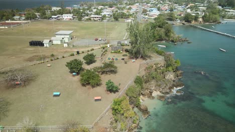Ascending-aerial-view-of-Fort-James-and-the-crystal-clear-waters-of-the-Caribbean-sea-on-the-island-of-Tobago