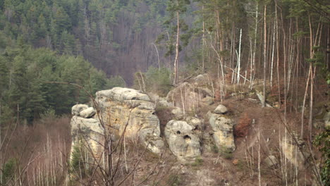 Hillside-boulders-overlooking-Kokorin-wilderness-in-Czech-Republic,-slow-pan