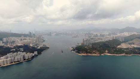 Aerial-shot-of-Hong-Kong-bay-skyline-on-a-cloudy-day