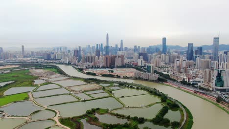Aerial-view-over-Shenzhen-cityscape-with-massive-urban-development-and-skyscrapers