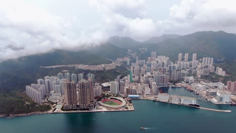 Hong-Kong-bay-and-waterfront-residential-skyscrapers,-Aerial-view