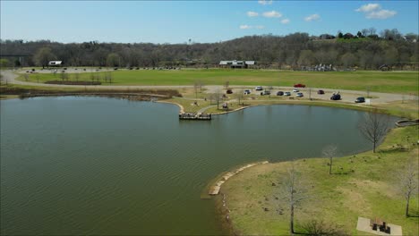 Drone-flyover-of-fishing-pond-at-Liberty-Park-in-Clarksville,-Tennessee