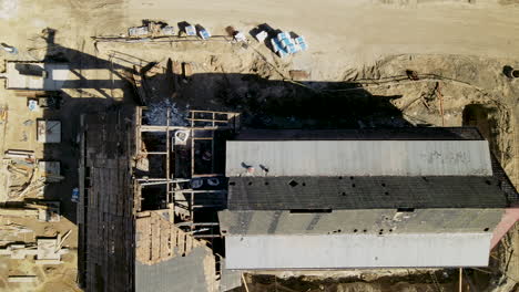 top-down-demolition-of-historic-roof-before-restoration,-aerial-shot