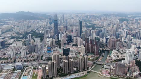 Aerial-view-over-Shenzhen-cityscape-with-massive-urban-development-and-skyscrapers