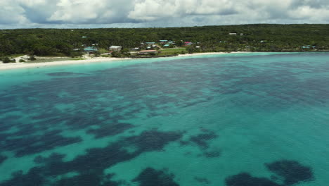 Aerial-view-around-the-Chateaubriand-Beach,-in-We,-Lifou---pan,-drone-shot