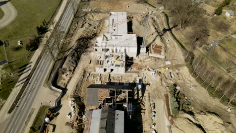 top-down-aerial-over-empty-building-site-on-sunny-day