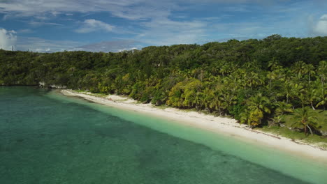 Aerial-pull-away-from-tropical-beach-of-Easo,-on-Lifou-Island,-New-Caledonia