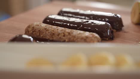 Healthy-Oatmeal-Protein-Bars-on-Wooden-Table-Surface,-Close-Up,-Slow-Motion