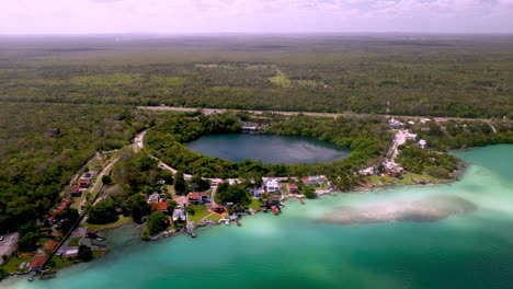 Drone-shot-of-homes-and-lagoon-at-Bacalar-Mexico
