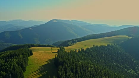 Aerial-drone-footage-view-of-Carpathian-mountains-with-a-beautiful-green-meadow-and-hills