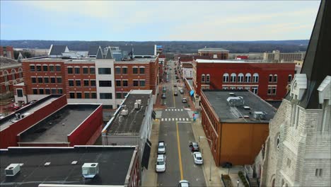 Low-drone-shot---Flying-down-a-downtown-city-street-in-Clarksville,-Tennessee