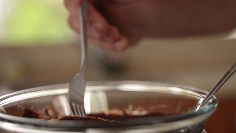 Chef-Dips-Homemade-Oatmeal-Protein-Bar-in-Molten-Chocolate,-Slow-Motion-Close-Up