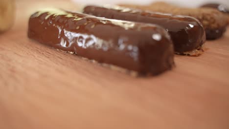Brown-Chocolate-Covered-Power-Bars,-Healthy-Lifestyle-Fitness-Snack,-Close-Up-Dolly-Out