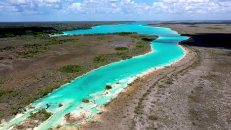 Cinematic-drone-shot-of-the-clear-blue-waters-at-Bacalar-Mexico