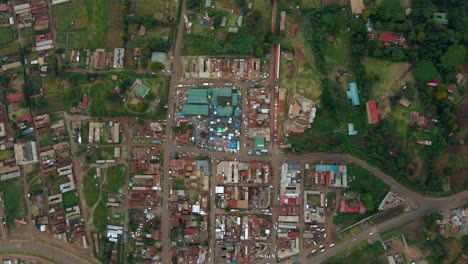 Aerial-view-above-a-market-and-a-east-African-town-center---overhead,-drone-shot