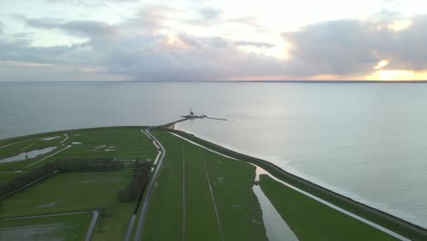Inland-sea-of-Holland-called-Markermeer-with-distant-lighthouse-at-dawn