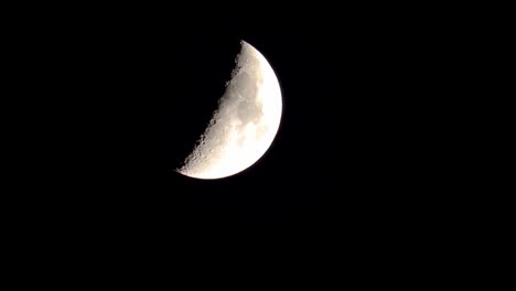 Closeup-of-quarter-moon-descending-on-the-screen-at-night
