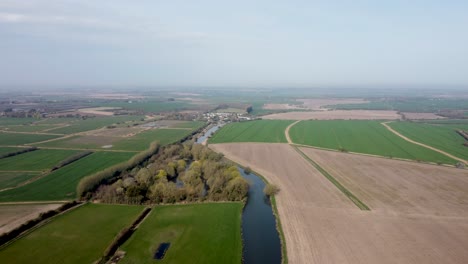 High-aerial-drone-shot-of-the-River-Stour-in-Kent,-England