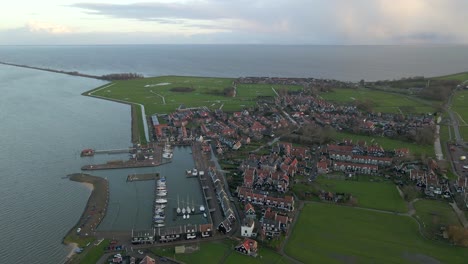 Historic-town-Marken-on-green-island-in-Markermeer,-Holland,-aerial