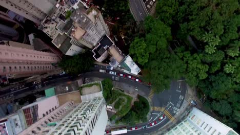 Traffic-At-City-Road-With-High-rise-Buildings-At-Central,-Hong-Kong