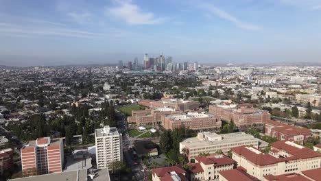 Downtown-Los-Angeles,-over-USC-Campus,-rising-aerial-view-on-cloudy-afternoon