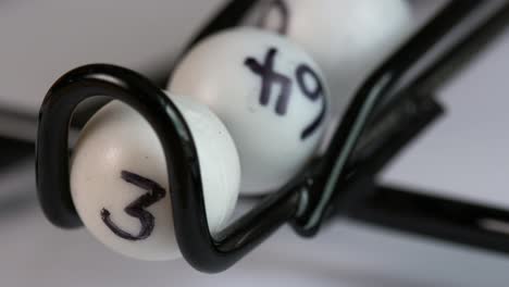 Close-up-of-a-lottery-or-Bingo-ball-catcher-as-the-winning-numbers-roll-out