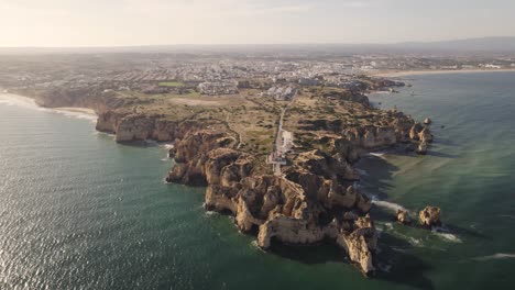 Ponta-da-Piedade,-headland-with-group-of-rock-formations-along-the-coastline-of-Lagos,-Algarve
