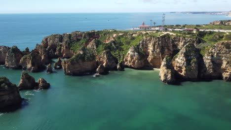 Sea,-islands-and-mountains,-beautiful-scenery-is-a-famous-tourist-attraction-of-Lagos,-Portugal