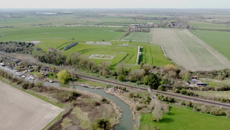 Aerial-drone-shot-of-the-River-Stour-through-farmland-in-Kent,-England