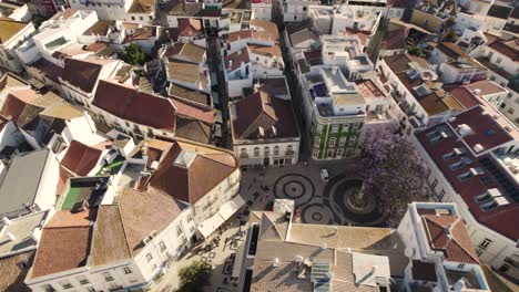 Overhead-aerial-top-down-view-traditional-square-with-narrow-streets-in-Lagos,-Algarve