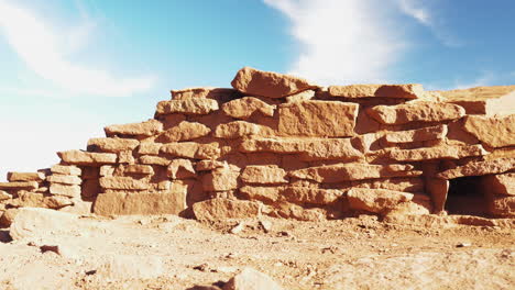 Panning-low-angle-shot-of-ruins-at-Wukoki-Pueblo