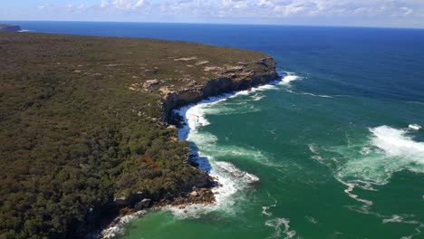 Bird's-Eye-View-Of-Coastal-Cliffs-With-Blue-Seascape-In-Royal-National-Park,-Sydney,-New-South-Wales,-Australia