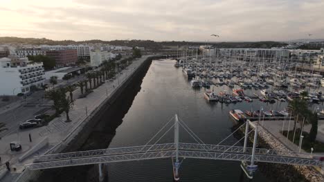 Aerial-shot-over-a-boat-dock-and-marina-with-yachts-on-the-coast-of-Portugal