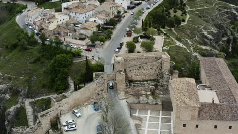 Cars-Passing-By-The-Wall-And-Arch-Of-Bezudo-At-Calle-Trabuco