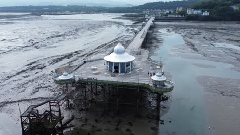 Bangor-Garth-pier-Victorian-ornamental-silver-dome-pavilion-landmark-tourist-aerial-view-seaside-attraction-slow-right-orbit-low