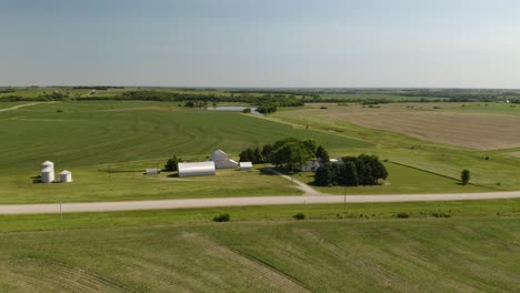 Drone-Flies-Above-Farm-House-on-Summer-Afternoon-in-Midwest-USA