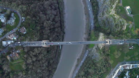 Top-down-Aerial-shot-above-Clifton-suspension-bridge-at-sunset-in-the-city-of-Bristol-on-the-River-Avon