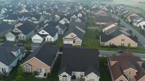 American-residential-development-aerial-establishing-shot-of-homes-at-dawn
