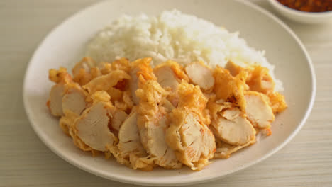 fried-chicken-topped-on-rice-with-spicy-dipping-sauce