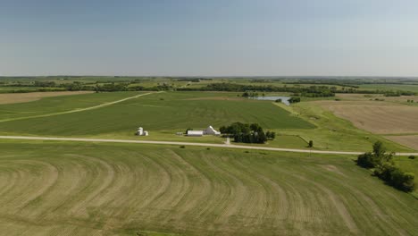 Cinematic-Establishing-Shot-of-Rural-Home-on-Large-Farm-and-Farmland